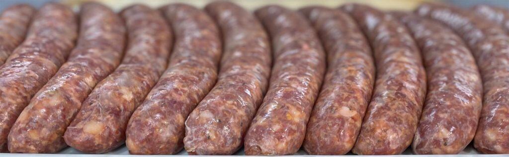 Fresh natural sausages made from high-quality meats perfect for cooking and grilling.